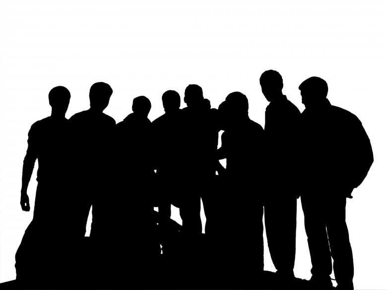 Silhouette of various adults, filled in with black, against a white background, standing side by side.